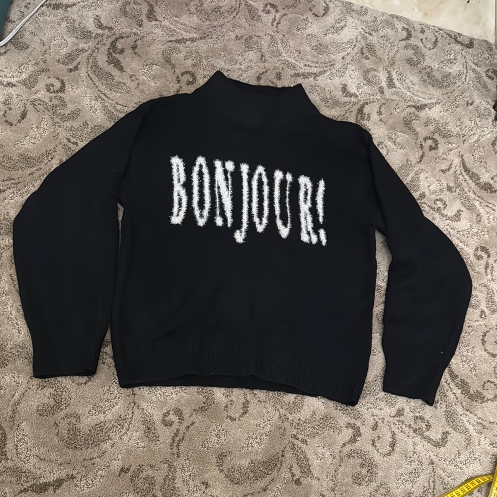 Black Sweater with 'BONJOUR!' Text